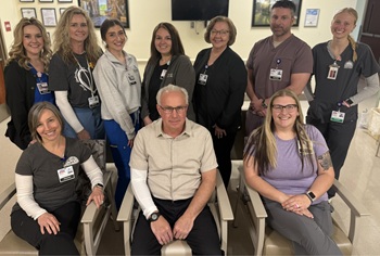 Fulton County Medical Center CEO Michael Makosky and some staff smiling in a group picture